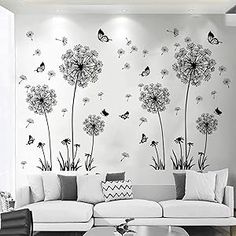 the living room is decorated with black and white wallpaper, including dandelions