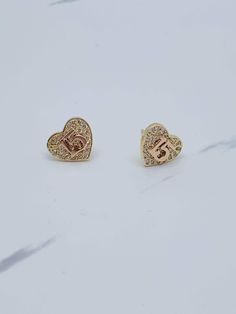 ❤️ 14k gold earrings Sweet 15 años   ❤️  ❤️ 3 Styles available  ❤️ Stones are white cubic zirconia  Style 1 Pushback closure (SKU 061194) Style 2  Screwback closure (SKU 06594p) Style 3  Pushback closure (SKU 06774) Each pair sold separately  ❤️ Aretes en oro de 15 años ❤️ 14 kilates oro auténtico  ❤️ Aretes de quinceañera de corazones pequeños  Estilo 1  Cerradura de mariposa (SKU 061194) Estilo 2  Cerradura de tornillo (SKU 06594 p) Estilo 3  Cerradura de mariposa (SKU 06774) ❤️ Piedra blanca zirconia  Cada uno se vende por separado Quinceanera Earrings Gold, 14k Yellow Gold Earrings For Birthday, Gold Earrings For Anniversary On Valentine's Day, Gold Pierced Earrings For Birthday, Personalized Gold Heart Earrings, Elegant Gold Jewelry For Sweet 16, Personalized Yellow Gold Jewelry For Sweet 16, Personalized Elegant Jewelry For Sweet 16, 14k Rose Gold Heart Earrings For Anniversary