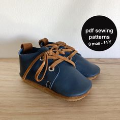 a pair of blue shoes sitting on top of a wooden table