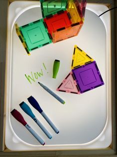 there are many different colored objects on the tray