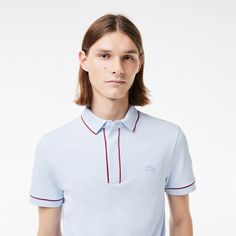 The Smart Paris polo shirt is a particularly elegant take on a Lacoste essential. Made from supple, breathable stretch piqué, with expert design details including a concealed button placket, ribbed trim and a tonal crocodile. A chic, timeless style. Classic Spring Polo Shirt For Golf, Modern Fitted Polo Shirt For Business Casual, Fitted Polo Shirt With Ribbed Collar For Golf, Formal Fitted Polo Shirt With Ribbed Collar, Classic Polo Shirt For Spring, Spring Workwear Polo Shirt With Ribbed Collar, Fitted Spring Polo Shirt, Fitted Golf Tops With Ribbed Collar, Fitted Tops With Ribbed Collar For Golf