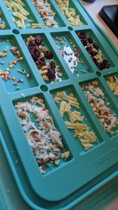 an ice tray filled with different types of food on top of a table next to a keyboard