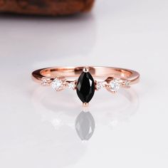 For a luxurious and sensual design, look no further than our breathtaking Ava luxe black onyx ring. Our team has handcrafted each ring with the finest materials, coupled with a gorgeous natural black onyx centerpiece and six perfectly round, natural crystals. A gentle design that’s easy on the eye and gorgeous, you’re sure to fall in love with this ring for any outfit. ✦ DETAILS ✦ ✧ 0.75 Carat center stone ✧ Natural black onyx and crystals ✧ Sizes 3.25-11.25 US ✧ This ring set will arrive ready Black Onyx Ring Gold, Ava Black, Black Onyx Ring, Ring Rose Gold, Onyx Ring, Natural Opal, Black Opal, Ring Sterling Silver, Ring Gold