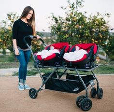 a woman standing next to a stroller with three baby seats on it's wheels