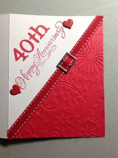 a red and white card with hearts on it that says 40th anniversary happy anniversary