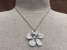 "Big, bold and unique silver flower pendant necklace. simple, refined and eye catching. It has incredible detail and design. The perfect everyday necklace for any nature lover. The pendant measures 1 3/8\" long by 1 3/8\" wide and made from allergy free plated silver. It hangs from a simple shiny 18\" stainless steel necklace chain with a lobster clasp. I have matching earrings in my shop if you would like the whole set. Here is a direct link https://etsy.me/37xz8Ql Thanks for stopping by! Pleas Silver Necklaces For Spring Gift, Silver Necklace For Spring Gift, Spring Gift Silver Necklace, Silver Metal Flower Pendant Necklace, Silver Necklaces With Flower Charm For Spring, Nickel Free Flower Shaped Necklace, Silver Necklace With Flower Charm For Spring, Silver Metal Pendant Flower Necklace, Silver Metal Necklace In Flower Shape