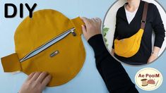 a woman is making a purse out of an old yellow piece of fabric and some scissors