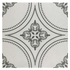 an ornate tile pattern with black and white designs on the sides, in various sizes