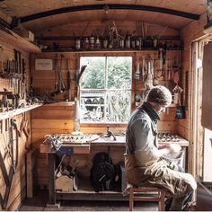 a man working in a workshop with lots of tools