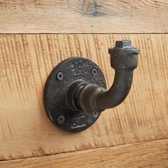 a metal hook on the side of a wooden door