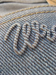 closeup of the stitchs on a blue and white suit