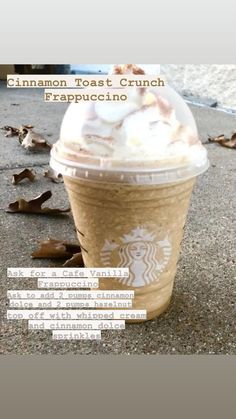 a cup of coffee sitting on top of a sidewalk next to leaves and the words cinnamon toast crunch frappuccino