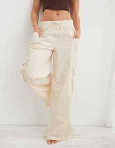 Cotton Wide-leg Pants With Drawstring, Cotton Bottoms With Functional Drawstring For Spring, Spring Cotton Bottoms With Functional Drawstring, Relaxed Fit Cotton Cargo Pants With Elastic Waistband, Relaxed Fit Cotton Cargo Jeans With Elastic Waistband, Cotton Cargo Jeans With Elastic Waistband And Relaxed Fit, Utility Style Cotton Cargo Jeans With Elastic Waistband, Utility Cotton Cargo Jeans With Elastic Waistband, Cotton Wide-leg Parachute Pants With Drawstring