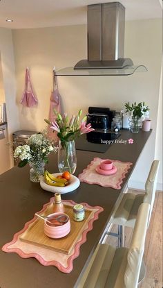 a kitchen counter with plates and bowls on it