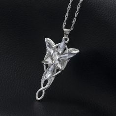 INCLUDES: (1) Lord of the Rings Arwen Evenstar Pendant Necklace SPECIFICATIONS: Metal: Eco-friendly, Nickel-free, lead-free, hypoallergenic Zinc alloy DIMENSIONS: Chain: 19.68 in (50cm) Length Pendant Width: 0.87 in (2.9cm) Pendant Height: 1.58 in (5.3cm) DESCRIPTION: Embrace the timeless elegance of Elven grace with this Lord of the Rings Arwen Evenstar Pendant Necklace. Inspired by Arwen's radiant Evenstar pendant in the iconic fantasy saga, this necklace is a tribute to love, courage, and the Elven Jewelry Necklaces, Lotr Collection, Arwen Necklace, Lord Of The Rings Necklace, Evenstar Necklace, Lord Of The Rings Arwen, Castles Crumbling, Arwen Evenstar, Elf Princess