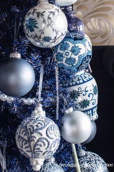 a blue and white christmas tree with ornaments