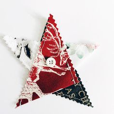 an ornament made out of fabric and buttons