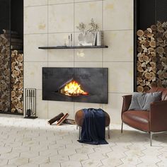 a living room filled with furniture and a fire place next to a wall mounted fireplace