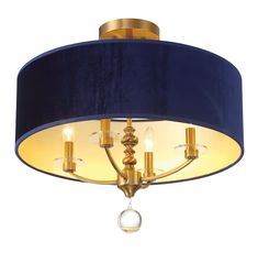 a blue and gold chandelier with three lights hanging from it's side