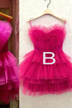 Fancyvestido this short hot pink homecoming dress features a sweetheart neckline with ruffles, a tiered a-line skirt, and a zipper back. ♡ SKU: FV11675♡ Fabric: Tulle♡ Size: US 2-16. True to the size chart. Check our Size Chart to get your correct size.♡ Besides stand sizes 2-16, we still offer free custom sizes. You can email me your specific size, before or after your order.Which requires the following measurements:Bust:___ inch/cmWaist:___ inch/cmHips:___ inch/cmHollow to Hem___inch/cm (for t Strapless Fitted Dress For Sweet 16, Sweet 16 Ruffled Dresses With Sweetheart Neckline, Sweet 16 Dress With Ruffles And Sweetheart Neckline, Sweet 16 Dresses With Ruffles And Sweetheart Neckline, Sweet 16 Dresses With Sweetheart Neckline And Ruffles, Pink Sweetheart Neckline Dress For Sweet 16, Pink Ruffled Homecoming Dress, Pink Ruffled Dress For Homecoming, Homecoming Mini Dress With Sweetheart Neckline And Ruffles