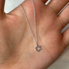 This super cute sterling silver dainty Star of David charm necklace is beautiful in its simplicity. A perfect size to wear every day on its own or layered with other simple chains. The Star of David necklace is a timeless piece of jewellery that symbolises Jewish heritage and faith. 💖 Details 925 Sterling Silver Pendant: 8 mm Length: choose from 40, 42 or 45 cm 💕 Online store: www.thejewellerytree.net 💕 Stay up-to-date with new designs & special offers  - FOLLOW ME   Socials: @myjewellerytree OR  https://www.facebook.com/thejewellerytree1/  💕 Need more info, feel free to email - I'd love to help 💕And please visit my store https://www.etsy.com/au/shop/TheJewelleryTreeCo to see lots more quality sterling silver and gemstone jewellery We care about the environment so when you buy any of Silver Star Of David Necklace With Adjustable Chain, Minimalist Star Of David Jewelry With Delicate Chain, Silver Star Charm Necklace With Clavicle Chain, Minimalist Sterling Silver Star Of David Jewelry, Sterling Silver Star-shaped Jewelry With Adjustable Chain, Minimalist Star Of David Sterling Silver Jewelry, Sterling Silver Star Charm Necklace For Everyday, Sterling Silver Star Jewelry With Adjustable Chain, Minimalist Silver Star Of David Jewelry