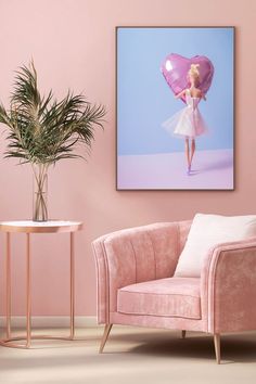 a living room with pink walls and a chair in front of a painting on the wall