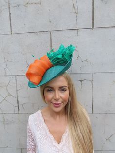 This hat is perfect for special occasions. Featuring striking statement feathers on a tilted sinamay disc hat. Mounted on a ribbon covered headband. The base measures 29cm across. Perfect for races, weddings and special occasions! Made in the UK    Many more items like this are available in our shop! Made in the UK - Feather Fascinator, Feather Fascinators, Jade Green, Green Orange, Green And Orange, Fascinator, About Uk, Feathers, Caps Hats