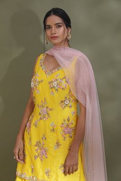 Dance the night away at sangeet and weddings in this alluring bright yellow embroidered sharara suit. It comes with a powder pink dupatta. Shop designer suits in USA from Pure Elegance. Yellow Embroidered Palazzo Set For Party, Yellow Floor-length Salwar Kameez With Sheer Dupatta, Yellow Sharara With Sheer Dupatta For Party, Yellow Floor-length Sharara With Sheer Dupatta, Yellow Chinon Sets With Sheer Dupatta, Yellow Floor-length Salwar Kameez For Reception, Yellow Palazzo Set With Dabka Work For Party, Yellow Chanderi Palazzo Set For Party, Yellow Chinon Dupatta For Reception