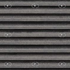 water drops are on the side of a metal grill grate that is lined with black and white stripes