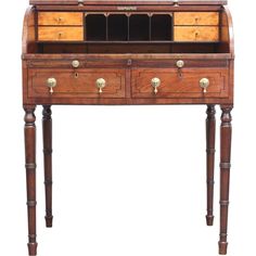 an old wooden desk with drawers and brass knobs on the top, against a white background