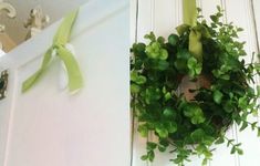 a green wreath hanging on the side of a door next to a white door handle