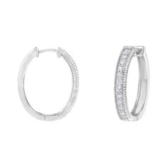 A pair of modern diamond hoop earrings that feature a row of round diamonds. Crafted in 10 karat white gold, they have a total diamond weight of 1 carat. Classic White Hoop Earrings With Pave Setting, Classic Channel Set Diamond White Hoop Earrings, Classic White Hoop Earrings With Diamond Accents, Classic White Hoop Earrings With Halo Design, Gold Diamond Hoop Earrings, Diamond Hoop Earrings, 1 Carat, White Gold Diamonds, Round Diamonds