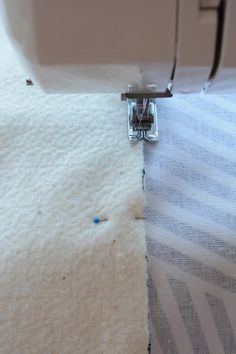 the sewing machine is stitching through the fabric to make it easier for someone to sew