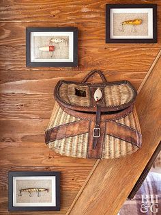 a brown purse sitting on top of a wooden table next to pictures and framed objects