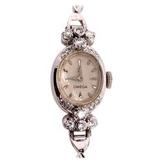 Rare Ladies Collectable OMEGA 14k White Gold with approximately 1.25 carat of Natural Diamond Manual Wind Cocktail Watch. It is set with 34 natural colorless diamonds weighing approximately 1.25 carats, the watch itself weighs 14.34 grams and is approximately 5.75" inches in length. Condition is Pre-owned. No original box, No original papers. Luxury Vintage Engraved Diamond Watch, Luxury Vintage Rectangular Watch Accessories, Luxury Vintage Evening Watches, Luxury Antique Watch Accessories For Anniversary, Omega Ladies, Shifting Items, Cocktail Watch, Ladies Wrist Watch, Cocktail Vintage