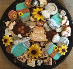 a platter filled with lots of decorated cookies