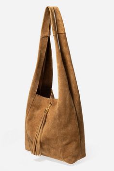 Crafted from 100% rich suede, the Tassel Chain Italian Suede Hobo Bag is perfect for daily use. Featuring a comfortable shoulder strap and wide top opening, this classic hobo style bag is finished with a decorative leather tassel at the front and a hook and eye closure. Pair with relaxed fit jeans and a casual blouse for a classic weekend look. Johnny Was Women's Tassel Chain Italian Suede Hobo Bag in Tan Brown, Leather/Suede Elegant Suede Hobo Bag For Everyday Use, Suede Crossbody Shoulder Bag With Gold-tone Hardware, Chic Suede Hobo Bag With Soft Leather, Chic Suede Hobo Bag With Suede Lining, Chic Suede Hobo Bag With Leather Handles, Chic Suede Hobo Bag With Adjustable Strap, Chic Suede Hobo Bag For Everyday, Chic Suede Crossbody Shoulder Bag, Chic Suede Shoulder Bag For Shopping