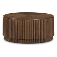 a round wooden table with pleated design