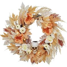 a wreath with flowers, leaves and a skull