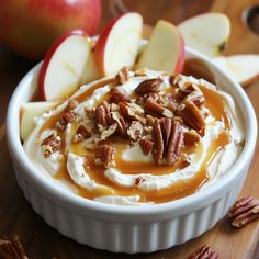 a bowl filled with whipped cream and pecans