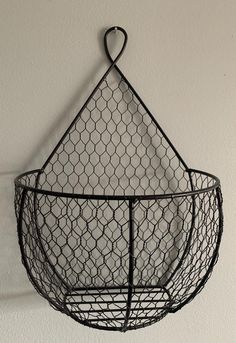 a wire basket hanging on the wall