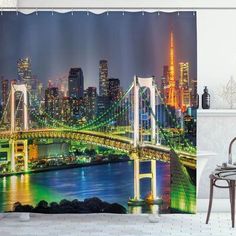 a bathroom with a cityscape shower curtain