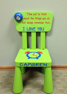 a green plastic chair with a message on it