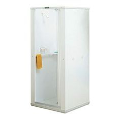 a white cabinet with a yellow towel hanging on the door