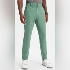 Profesh Meets Performance. With Business-Casual Style, Lightweight Fabric, And Liquid-Resistant Tech, This Elevated Performance Pant Has All The Essentials To Go From Office Hours To Happy Hours. Features Zip Pockets External Pocket Lightweight Water Repellent Fabric 45% Polyester, 45% Recycled Polyester, 10% Spandex Imported. Sporty Green Pants With 4-way Stretch, Green 4-way Stretch Athleisure Pants, Functional Green Pants With 4-way Stretch, Casual Spring Golf Bottoms, Athleisure Stretch Bottoms For Golf, Stretch Athleisure Bottoms For Golf, Casual Moisture-wicking Pants With 5-inch Inseam, Casual Green Activewear With 4-way Stretch, Fitted Athleisure Bottoms For Golf