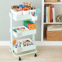 a cart filled with lots of craft supplies