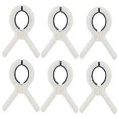 six white plastic scissors with black handles