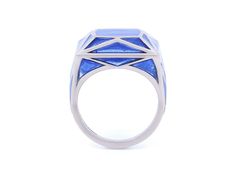 Blue plique-à-jour enamel ring in 18K white gold. Signed SA-P for Solange Azagury-Partridge, with English hallmarks. The retail price is £5800 (approximately $7500). Plique-à-jour is a difficult enameling process in which enamel is applied to an area with no backing instead of onto metal. The result is the enamel is transparent or translucent. Modern White Gold Rings With Enamel, Blue Jewelry With Black Enamel For Formal Occasions, Blue Enamel Fine Jewelry Ring, Blue Enamel Ring Fine Jewelry, Blue Enamel Ring In Fine Jewelry Style, Modern Enamel Rings For Formal Occasions, Blue Polished Enamel Ring, Blue Enamel Polished Round Ring, Blue Enamel Ring With Polished Finish