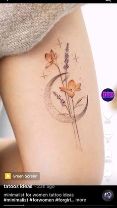 an image of a tattoo on the side of a woman's leg with flowers