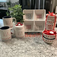 the kitchen counter is decorated with patriotic dishes and mugs